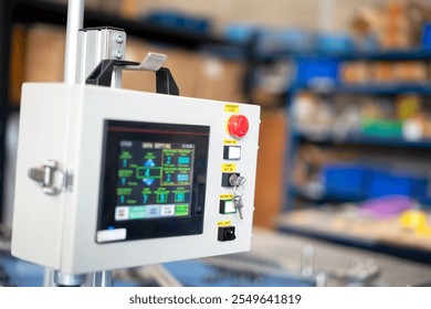 close up of operation panel with touch screen of automation machine in production line