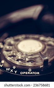 Close Up Of The Operator Dial On A Black Vintage Telephone With Filtered Effect