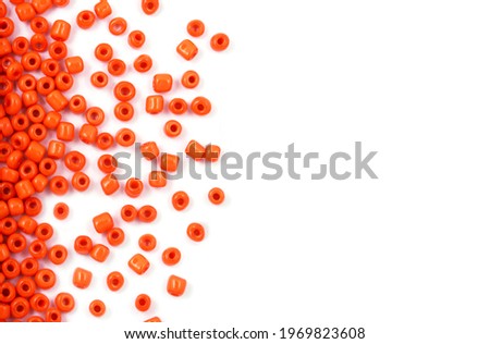 Close up of Orange Beads on the white background. Background or texture of beads. macro,It is used in finishing fashion clothes. make bead necklace or string of beads for woman of fashion.