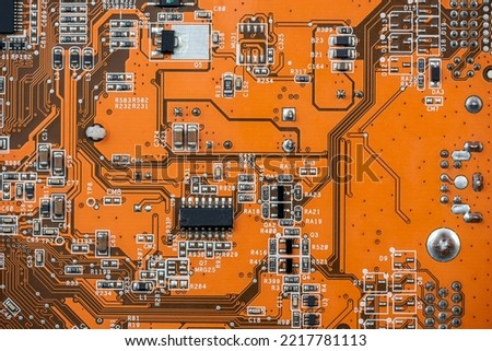 close up of Orange circuit board, motherboard technology background. computer component