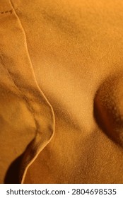 Close Up Orange Fabric Surface Texture with Visible Weave and Soft Textile Detail Macro Shot HD Studio