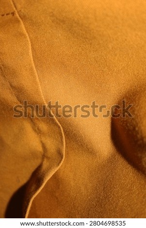 Close Up Orange Fabric Surface Texture with Visible Weave and Soft Textile Detail Macro Shot HD Studio