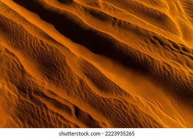 Close up orange sand texture in Empty Quarter Desert in United Arab Emirates. Sand dunes. Abstract sand texture. - Shutterstock ID 2223935265