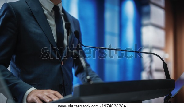 Close up of a\
Organization Representative Speaking at Press Conference in\
Government Building. Press Officer Delivering a Speech at Summit.\
Minister Speaking at Congress\
Hearing.