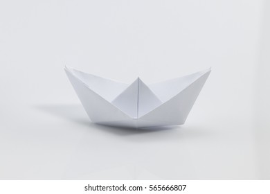 Close Up Origami Ship Isolated On White Background.