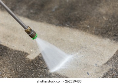 Close up Outdoor floor cleaning with high pressure water jet