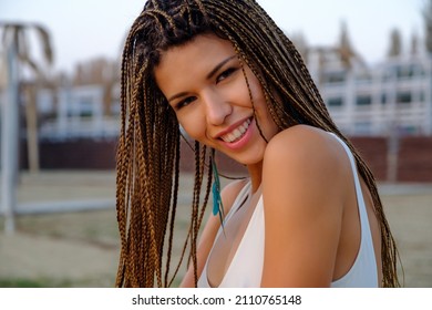 Close up outdoor portrait of attractive asian european model girl with braided hairstyle.