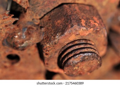 Close up outdoor view of a group of welded rusty elements. Brown and orange texture. Old bolds and nuts. - Shutterstock ID 2175460389