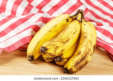 Close up of Over Ripe Bananas isolated of a wooden background with copy space - Shutterstock ID 2342127061