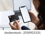 Close up over shoulder view of woman hold smartphone and credit card shopping online on gadget, female enter internet banking system, make purchase pay bills taxes on web, mockup screen concept