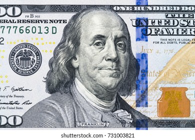 Close Up Overhead View Of Benjamin Franklin Face On 100 US Dollar Bill. US One Hundred Dollar Bill Closeup. Heap Of One Hundred Dollar Bills On Money Background. 