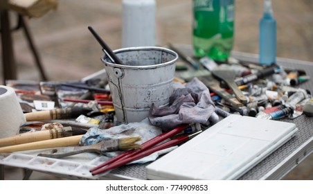 Close up of the paint brush of a painter