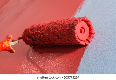 Close Up Paint Roller On The Wall.