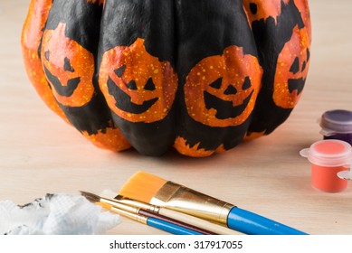 Close Up Of Painting  A Pumpkin For Halloween.