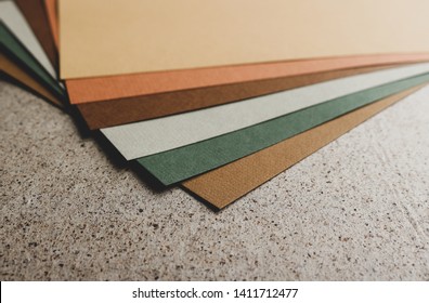 Close Up Of A Paper Sheets In A Stack In Various Warm Autumn Colours On A Fine Art Cardboard.