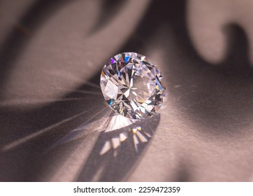 Close up of a pare of blue and white diamonds of different cuts with shadows. - Shutterstock ID 2259472359