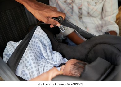 Close Up Of Parents Bringing Newborn Baby Home In Car