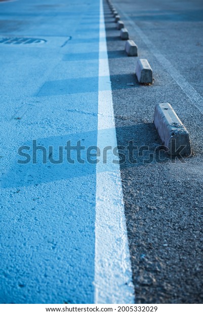Close\
up of parking lot in public areas with blue\
tone.