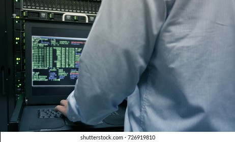 Close up part of administrator working in data center