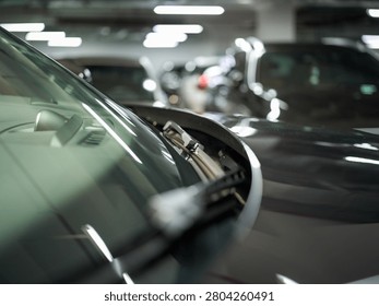 close up partial view of parked car in indoor parking lot