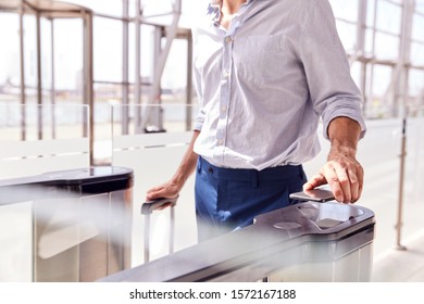 Close Up Of Passenger In Airport Departure Lounge Scanning Digital Boarding Pass On Smart Phone - Powered by Shutterstock - Get 15% off with code: PIKWIZARD15