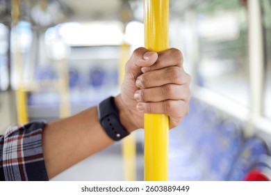 Close Up Of Passengers Perspective While Holding A Metal Pole On A City Bus During The Ride