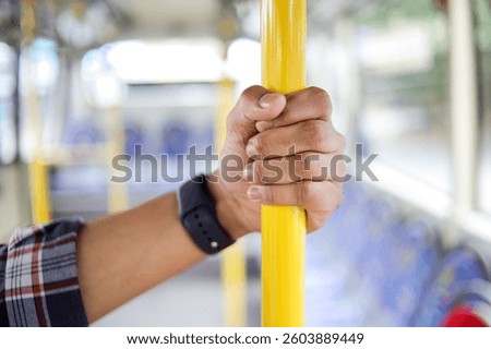 Close Up Of Passengers Perspective While Holding A Metal Pole On A City Bus During The Ride