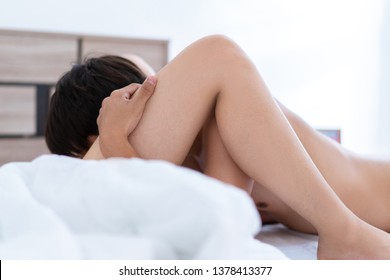 Close up of passionate young asian couple having sex on bed.