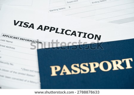 Close up of passport and visa application form.