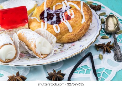 Close up of pastries, piece of cake and assorted spices.