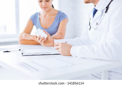 Close Up Of Patient And Doctor Prescribing Medication