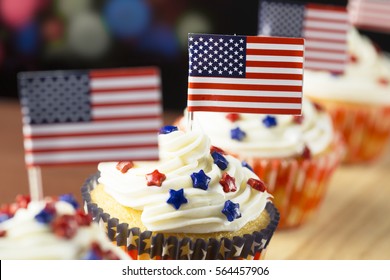 Close Up Of Patriotic Cup Cake With Red White And Blue Star Topping And American Flag. Shallow Depth Of Field.