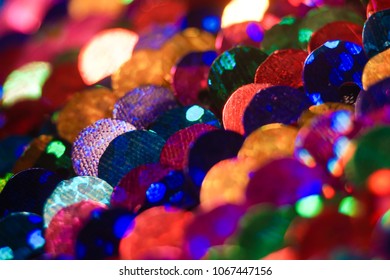 Close Up Of Pattern Made Of Colorful Rainbow Sequins Shimmering And Sparkling.