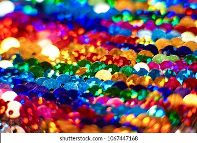 Close Up Of Pattern Made Of Colorful Rainbow Sequins Shimmering And Sparkling.