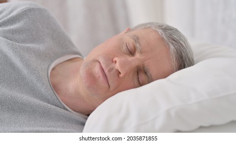 Close Up Of Peaceful Old Man Sleeping In Bed