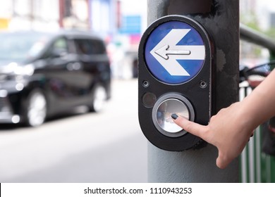 Close Up Pedestrian Crossing Call Button. Hand Pushing Button To Cross