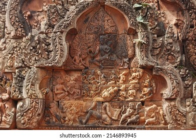 Close up of  Pediment shows Shiva seated on the summit of Mount Kailash, his mythological abode. His consort Uma Devi sits on his lap and clings anxiously to his torso at at Banteay Srei Temple