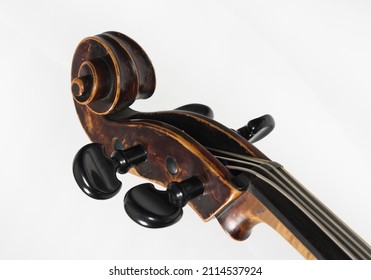 Close up of a Pegbox from an upright bass isolated on white background 