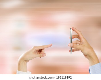 Close up of people hands using mobile phone
