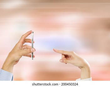 Close up of people hands using mobile phone