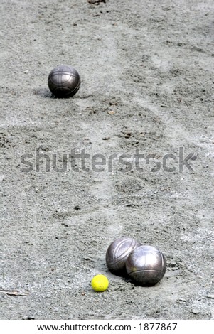 close up of people at sport,  a woman playing the french petanque