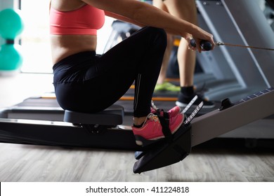 Close Up Of People Using Equipment In Busy Gym - Powered by Shutterstock