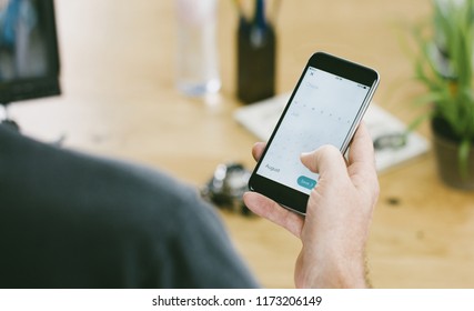 Close up of people using a smartphone with touch display