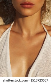 Close Up Of Perfect Lady`s Chest With Bronze Skin In White Textured Dress In Sun Light  - Image