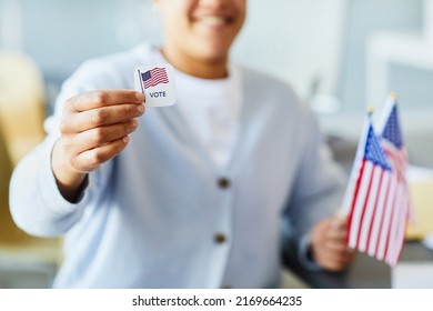 Close Up Of Person Holding Voting Sticker And American Flag, Focus On Foreground, Copy Space