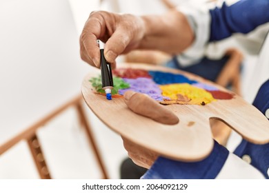 Close Up Of Person Pouring Oil Paint On Colorful Palette At Art Studio