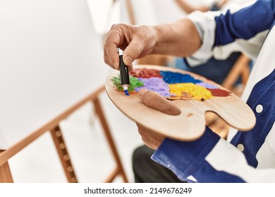 Close Up Of Person Pouring Oil Paint On Colorful Palette At Art Studio