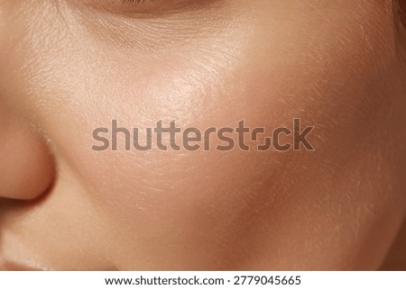 Close up of a persons smooth skin with subtle texture and light reflection