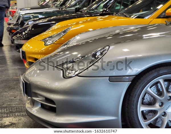 Close up perspective of Porsche cars in trade fair for\
collectors of vintage and luxury models Turin Italy January 30 2020\
   