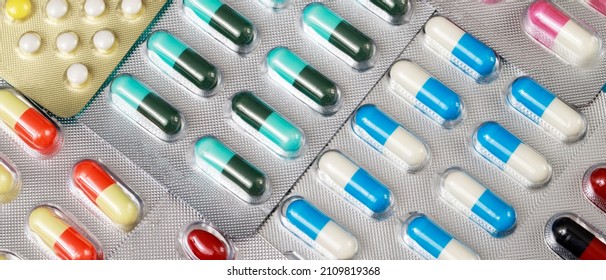 close up pharmaceuticals antibiotics pills medicine in blister packs. colorful antibacterials pills Pharmacy background. capsule pill medicine Antimicrobial drug resistance. Pharmaceutical industry